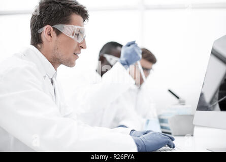 group of scientists conduct research in the laboratory Stock Photo