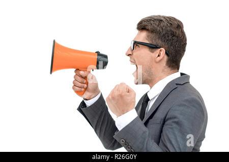 close up. angry businessman shouting into megaphone Stock Photo
