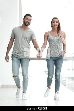 couple standing in the lobby of a modern building Stock Photo