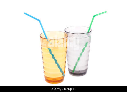 Plastic glasses with water, ice cubes and straws isolated on white background. Stock Photo