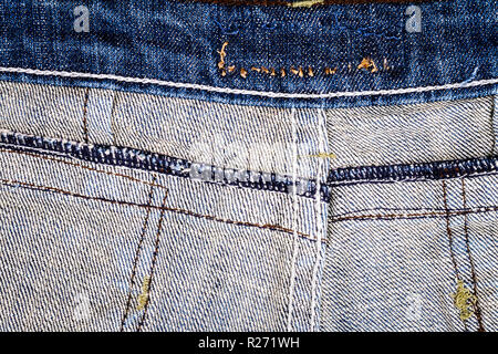 Wrong side of blue jeans with a back seams. Fabric tecture background Stock Photo