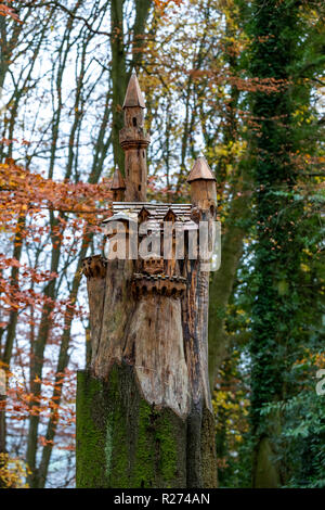 A fairytale castle carved into a tree trunk. Autumn at the Rococo Garden, Gloucestershire, UK. Situated in the Cotswolds. Stock Photo