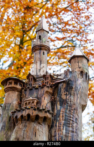 A fairytale castle carved into a tree trunk. Autumn at the Rococo Garden, Gloucestershire, UK. Situated in the Cotswolds. Stock Photo