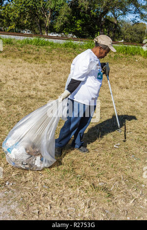 Miami Florida,Oakland Grove,Annual Little River Day Clean Up,trash,pick up,picking,litter,clean,pollution,volunteer volunteers volunteering work worke Stock Photo