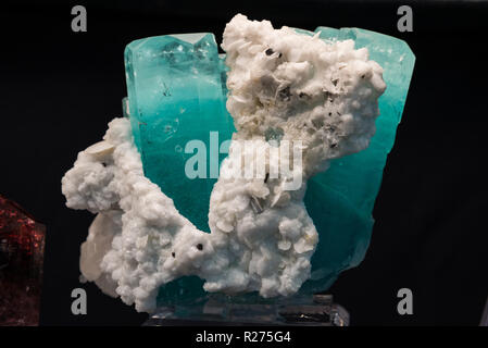 Blue crystals of mineral aquamarine, a variety of beryl, in white matrix. Stock Photo