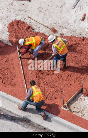 Miami Beach Florida,Ocean Drive,hotel,under new construction site building builder,building site,work,poured,concrete,street,sidewalk,man men male adu Stock Photo