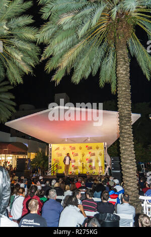 Miami Beach Florida,Lincoln Road Mall,South Beach Comedy Festival,festivals fair,Baron Vaughn,comedian,outdoor performance,perform,stage,Black man men Stock Photo