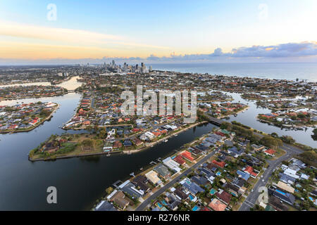 The canals and highrise area of the Gold Coast seen at sunrise from 150 meters above sea level on a hot air balloon, in Queensland, Australia Stock Photo