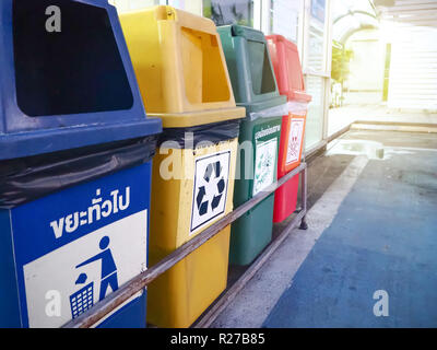 Four colorful garbage, bin trash bin at the outside. Stock Photo