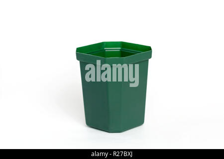 Empty plastic green flower pot isolated on white background. Stock Photo