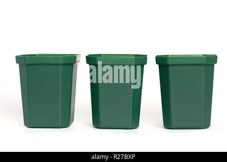 Empty plastic green flower pots isolated on white background. Stock Photo