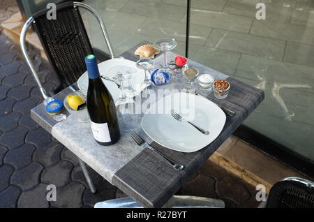 Elevated view of table setting outside a seafood restaurant, Paris, France Stock Photo