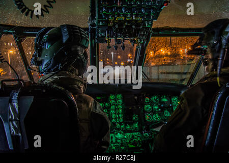 Royal Navy Search & Rescue operating from RNAS Culdrose on a training mission over the coast of Cornwall. Stock Photo