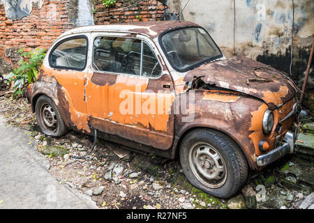 Old, abandoned car in the Talad Noi area of Chinatown, Bangkok, Thailand Stock Photo