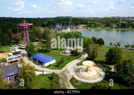 Amusement park in Chorzow, Upper Silesia, Poland. General landscape of park with lake and carousels. Stock Photo