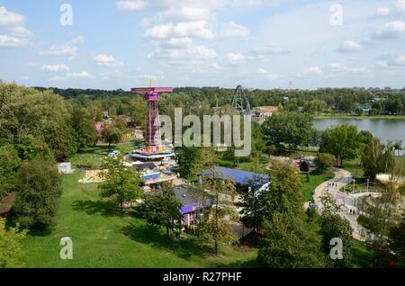 Amusement park in Chorzow, Upper Silesia, Poland. General landscape of park with lake and carousels. Stock Photo