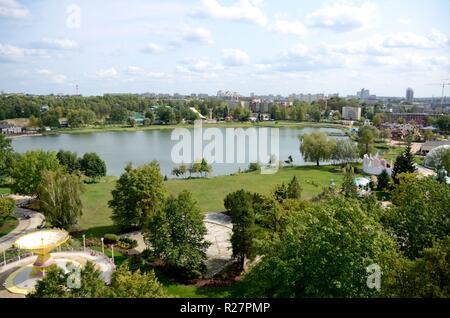 Amusement park in Chorzow, Upper Silesia, Poland. General landscape of park with lake and carousels. Stock Photo