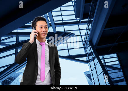 Portrait of asian businessman talking on the phone Stock Photo