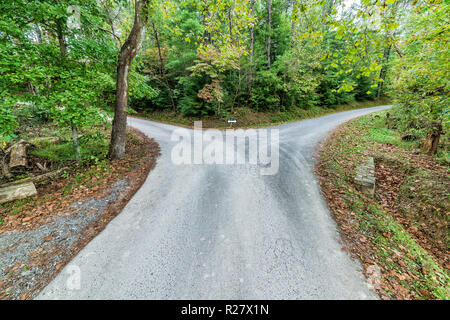 Horizontal shot of a fork in the road.  Decision time. Stock Photo