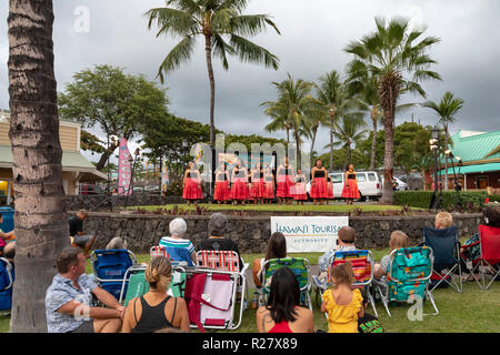 Kailua-Kona, Hawaii - The dancers of Halau Ka’eaikahelelani perform traditional hula at the Coconut Grove Marketplace on Hawaii's Big Island. Stock Photo