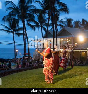 Kailua-Kona, Hawaii - The dancers of Halau Ka’eaikahelelani perform traditional hula at the Coconut Grove Marketplace on Hawaii's Big Island. Stock Photo