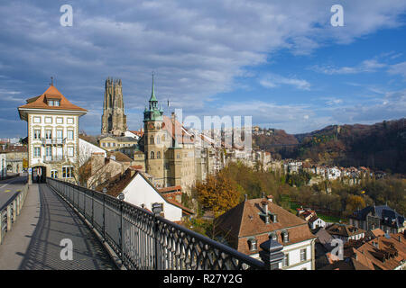 Fribourg, Switzerland, view of the Lower Town with in the background, the St. Nicholas Cathedral and the Gottéron Bridge. Stock Photo