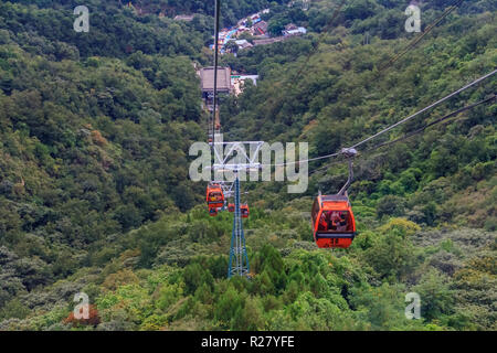 Mutianyu, China - September 19, 2013: Aerial lift taking tourists to the Great Wall of China in Mutianyu village, a remote part of the Great Wall near Stock Photo