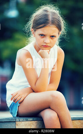 portrait of sad girl being alone and worried outdoors Stock Photo