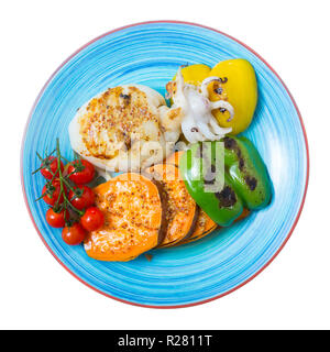 Image of sepia fried on a grill with pepper, boiled batat and honey-mustard sauce on the plate. Isolated over white background Stock Photo
