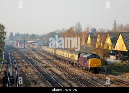 A class 37 diesel locomotive number 37416 working a train of empty coaching stock at West Drayton. Stock Photo