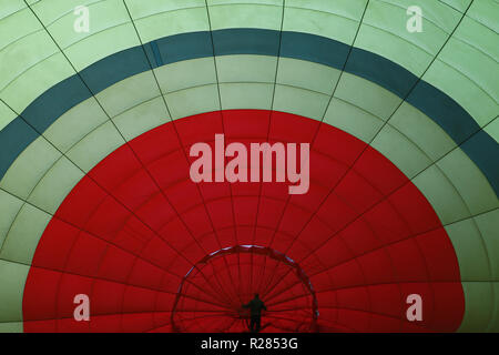 Pokhara, Nepal. 17th Nov, 2018. A man pulls the hot air balloon during the opening ceremony of Balloon Nepal in Pokhara, Nepal on Saturday, November 17, 2018. Credit: Skanda Gautam/ZUMA Wire/Alamy Live News Stock Photo