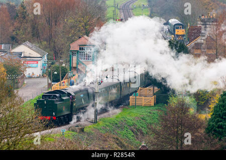 Corfe Castle, Dorset, UK.  17th November 2018. UK Weather.  A steam train, 257 Squadron, on the Swanage Railway at Corfe Castle in Dorset leaving the station on a chilly and cloudy overcast morning.  Picture Credit: Graham Hunt/Alamy Live News Stock Photo