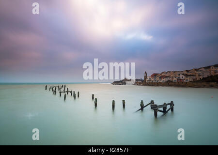 Swanage, Dorset, UK.  17th November 2018. UK Weather.  The remains of the old pier at the seaside town of Swanage in Dorset on a chilly and cloudy overcast start to the morning.  Picture Credit: Graham Hunt/Alamy Live News Stock Photo