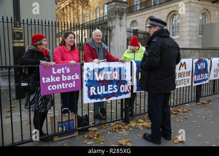 London, UK. 14th Nov, 2018. Pro- Brexit protesters are seen holding placards during the protest at Downing Street.Few Brexit supporters gathered in front of Downing Street together with their Pro Brexit placards to show their support to the Conservative government led by Theresa May for the negotiations carried out between the UK and the European Union over Brexit terms. Credit: Dinendra Haria/SOPA Images/ZUMA Wire/Alamy Live News Stock Photo