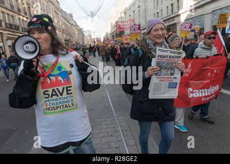 London, UK. 17th November 2018. A woman in a Save Hammersmith & Charing X Hospital t-shirt.Thousands marched from the BBC to a rally in Whitehall calling for unity against the rising threat of Islamophobia and Antisemitism by far-right groups in the UK, with a level of support for fascism not seen since the 1930s. The event was initiated by Stand Up To Racism, co-sponsored by Unite Against Fascism and LoveMusic HateRacism, and supported by many other groups and individuals including Diane Abbott MP and John McDonnell MP. Peter Marshall/Alamy Live News Stock Photo