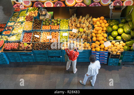 People at fruit stall in Markthal, Rotterdam, Zuid Holland, Netherlands
