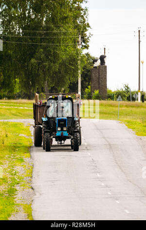 Igovka, Belarus - July 8, 2017: Belarus tractor rides in the village on the way Stock Photo