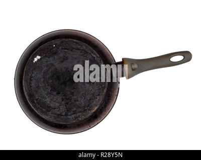 Old encrusted, burned frying pan, isolated on white. Underside. Stock Photo