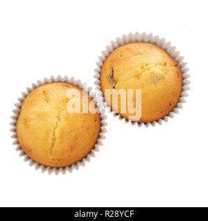 Homemade fruit muffins, cupcakes isolated on white background. Two small home baked cakes, overhead flat lay. Stock Photo