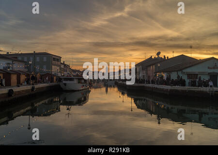 Reflected  sunset on the Leonardo 's port-canal in Cesenatico Stock Photo