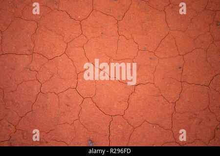 Red cracked mud background in Australian outback billabong. Stock Photo