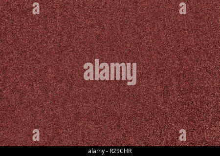 Dark brown matte background of suede fabric, closeup. Velvet texture of seamless red woolen felt. Stock Photo