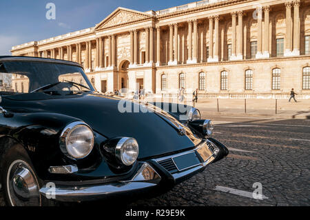 Beautiful black vintage car parked in front of the Louvre Museum, Paris, France Stock Photo