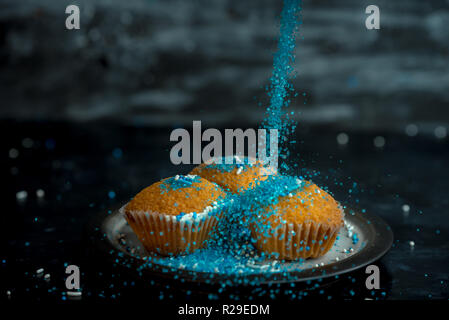 lemon muffins sprinkled with blue and white sprinkles Stock Photo