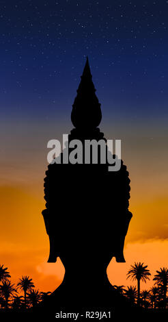 The black outline of Buddha head on color background with stars on heaven.The dark head silhouette with historical helmet with sunset and palm trees. Stock Photo