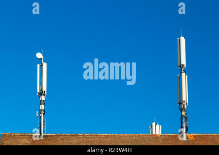 Cell tower on a rooftop in Germany Stock Photo