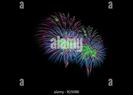 Colorful fireworks display against on night sky. Stock Photo