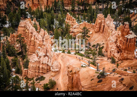people walking along a footpath in bryce canyon national park in Utah Stock Photo