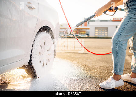 Washing car with pressure washer at self-service car wash station Stock  Photo - Alamy