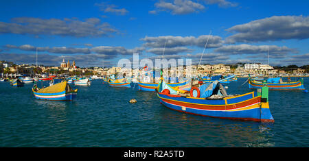 Marsaxlokk village port on the Mediterranean island of Malta with the traditional local boats. Stock Photo